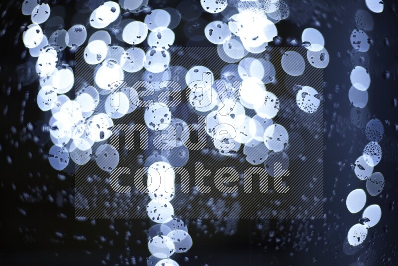 Bokeh light in white with water drops