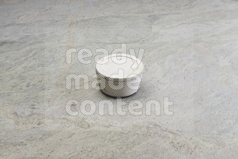 White Pottery Bowl On Grey Marble Flooring