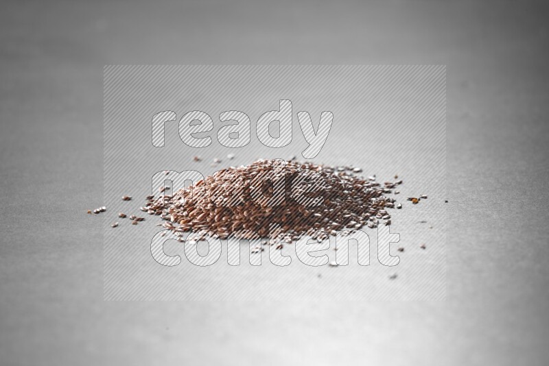Flax seeds on a black flooring