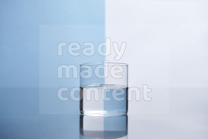 The image features a clear glassware filled with water, set against white and light blue background