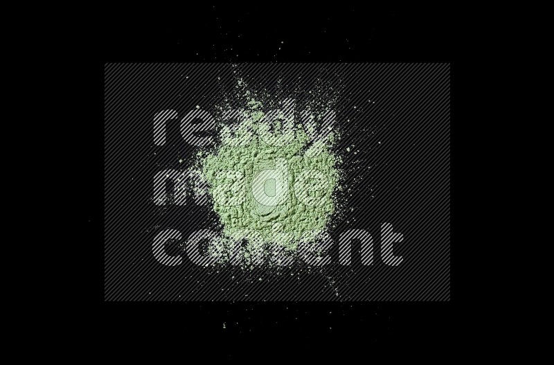 Green powder on black background