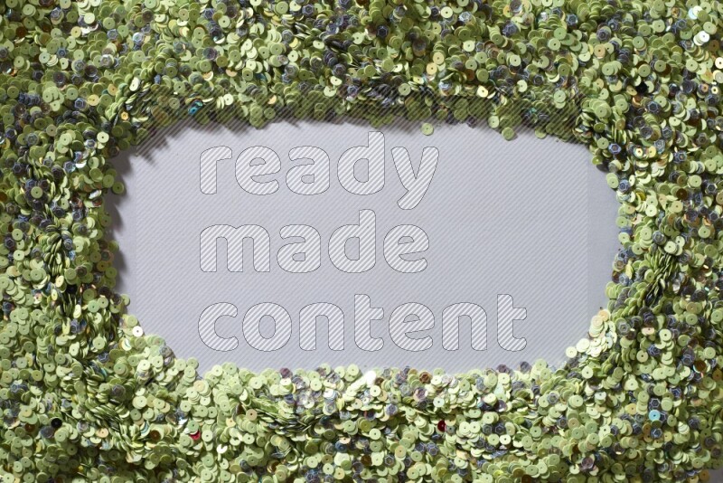 Multicolored flat sequins on grey background