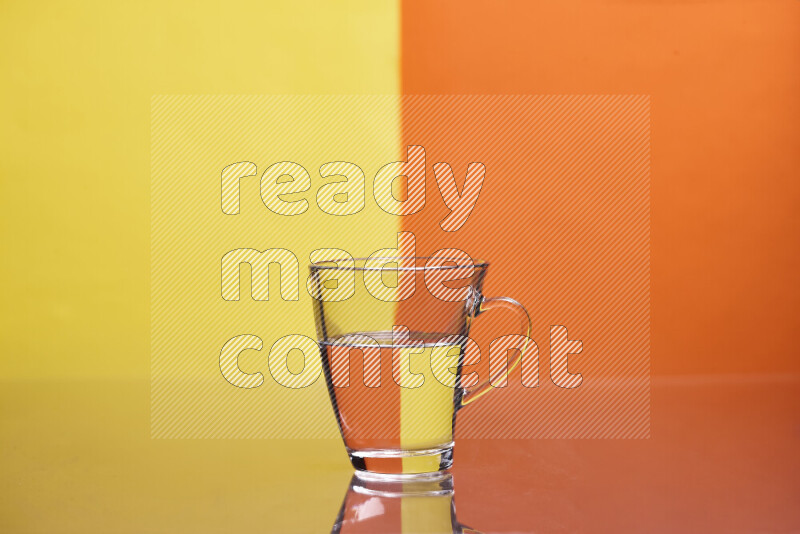 The image features a clear glassware filled with water, set against yellow and orange background
