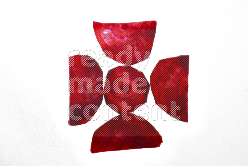 Beet slices on illuminated white background