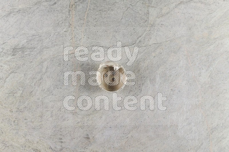 Top View Shot Of A Pottery Soap Dish On Grey Marble Flooring