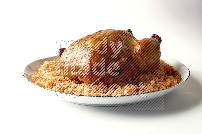 red basmati Rice with whole roasted chicken on a white plate with a silver rim direct on white background