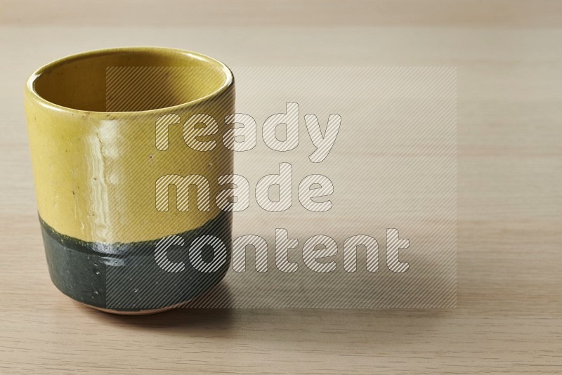 Multicolored Pottery Cup on Oak Wooden Flooring, 15 degrees