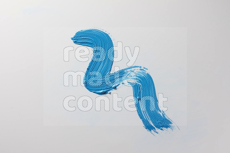 A single blue zigzag brush stroke on a white background