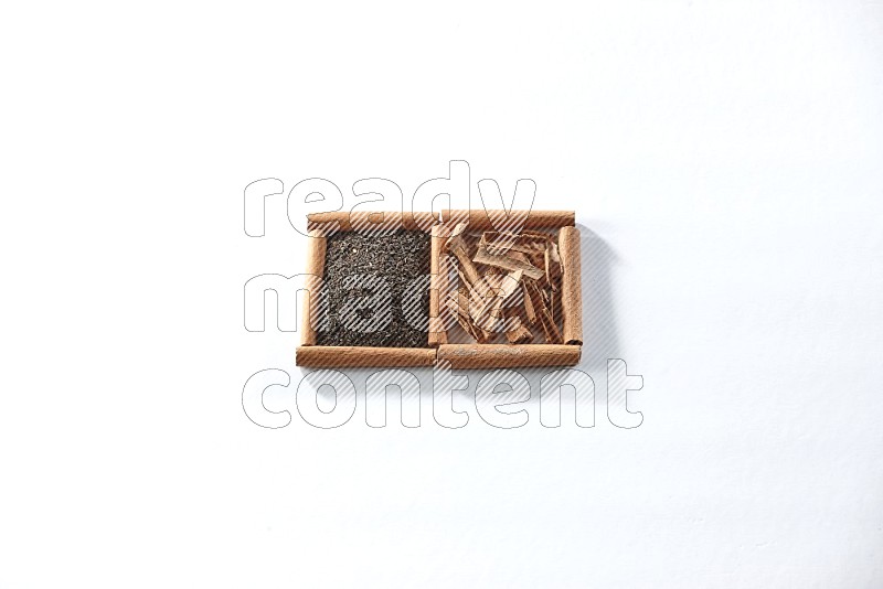 2 squares of cinnamon sticks full of black tea and cinnamon on white flooring