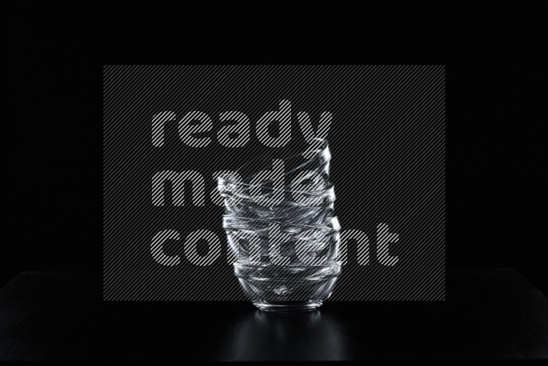 Glassware with rim light against black background