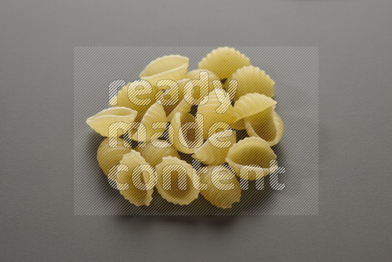Shells pasta on grey background