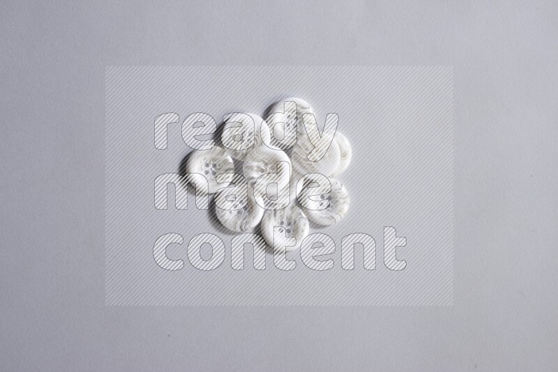 White buttons placed on grey background