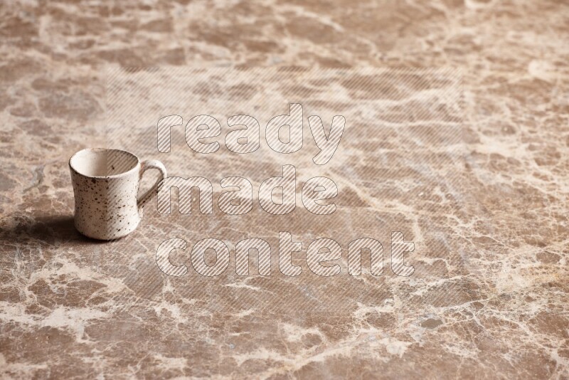 Pottery Cup on Beige Marble Flooring