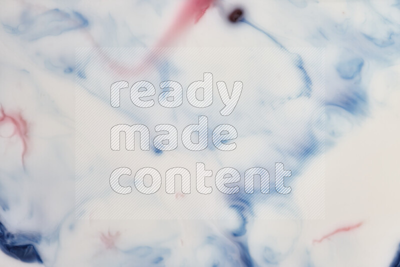 A close-up of abstract swirling patterns in blue, red and white