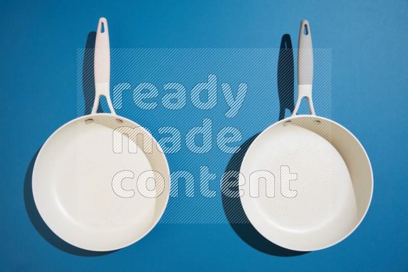 white pan on blue background