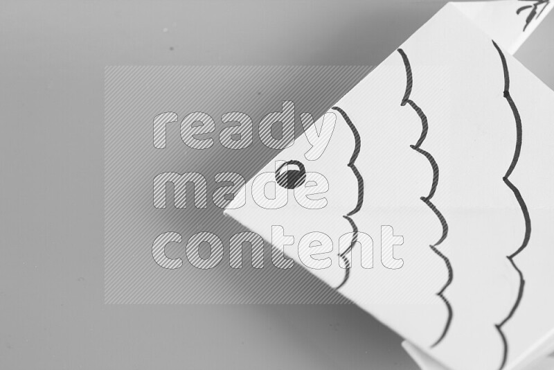 Origami fish on grey background