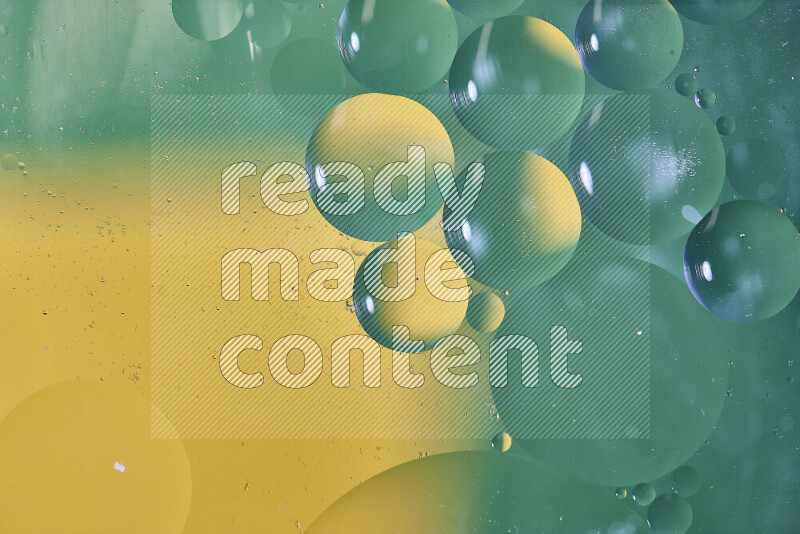 Close-ups of abstract oil bubbles on water surface in shades of green and yellow