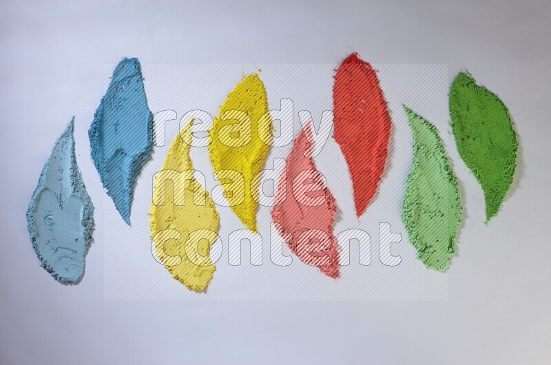 Multicolored powder strokes on white background