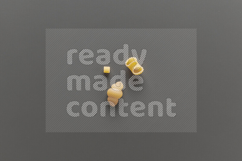 Different pasta types on grey background