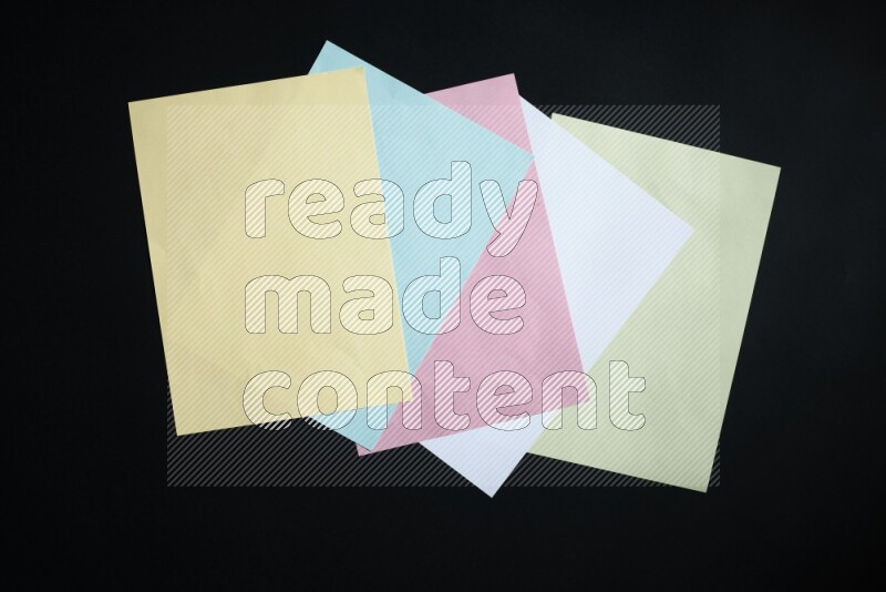 Multicolored paper sheet on black background