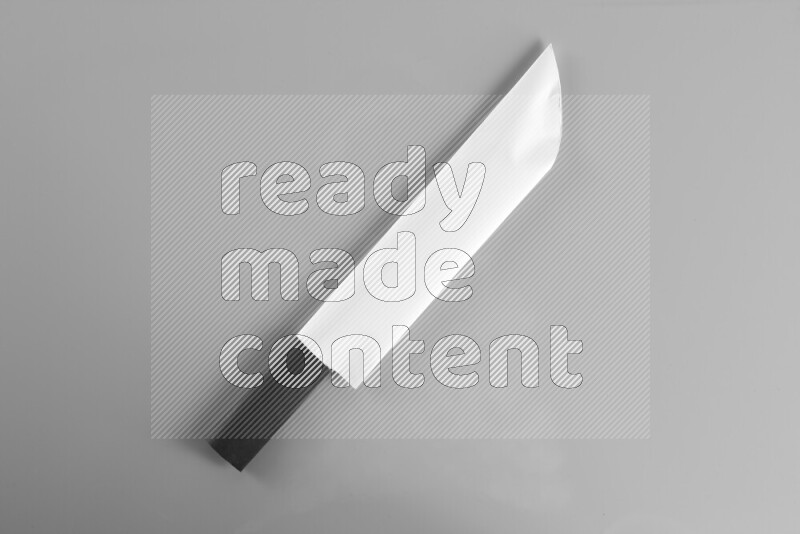 Origami sword on grey background