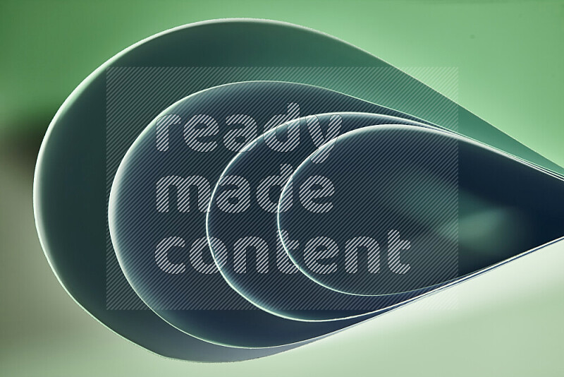 An abstract art of paper folded into smooth curves in green gradients