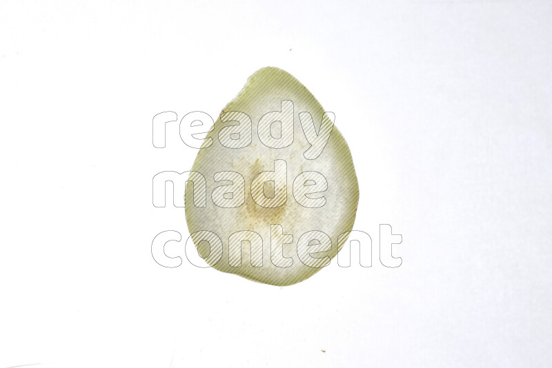 Pear slices on illuminated white background