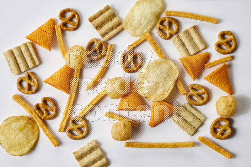 Assorted snacks on white background