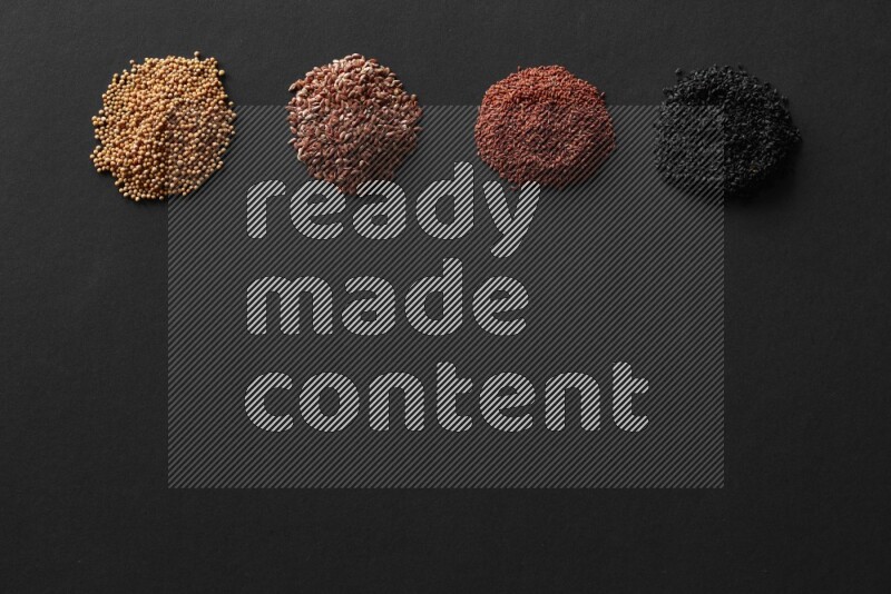 حبة البركة و حبوب الخردل وحبوب الكتان وحب الرشاد علي خلفية سوداء