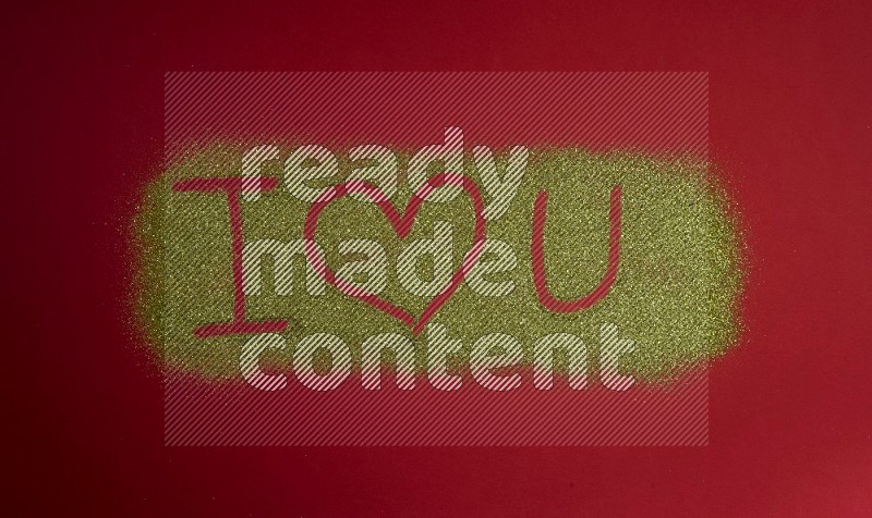 A sentence written with gold glitter on red background