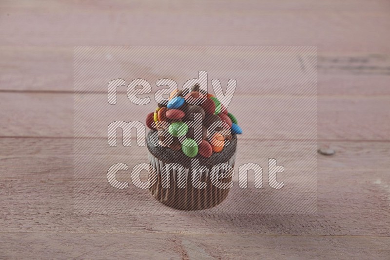 Chocolate mini cupcake topped with m&ms