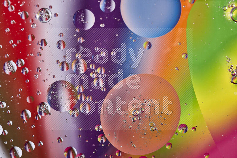 Close-ups of abstract oil bubbles on water surface in multicolors