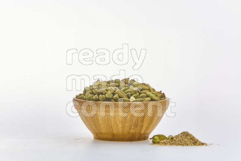 Cardamon in a container on white background