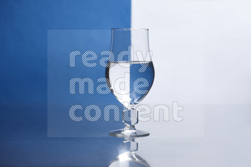 The image features a clear glassware filled with water, set against white and blue background