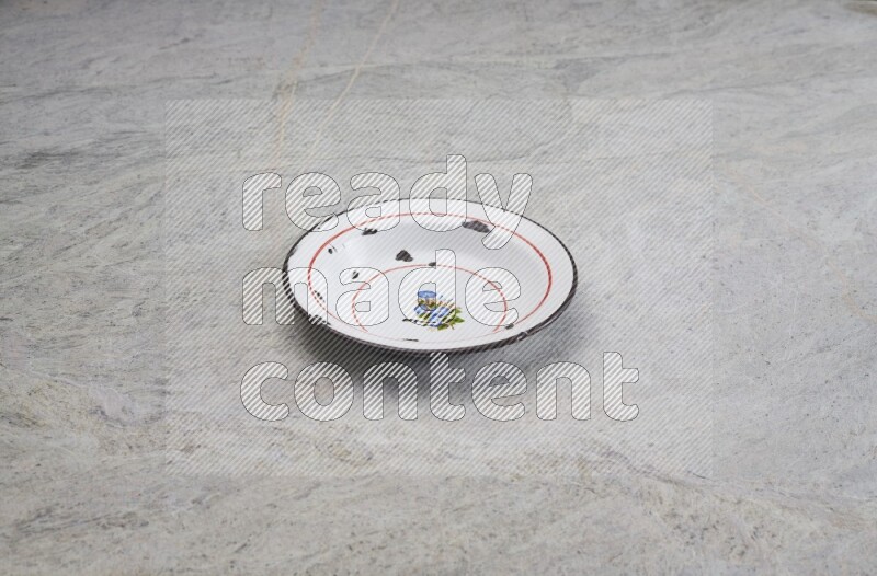 A vintage metal plate on grey marble background