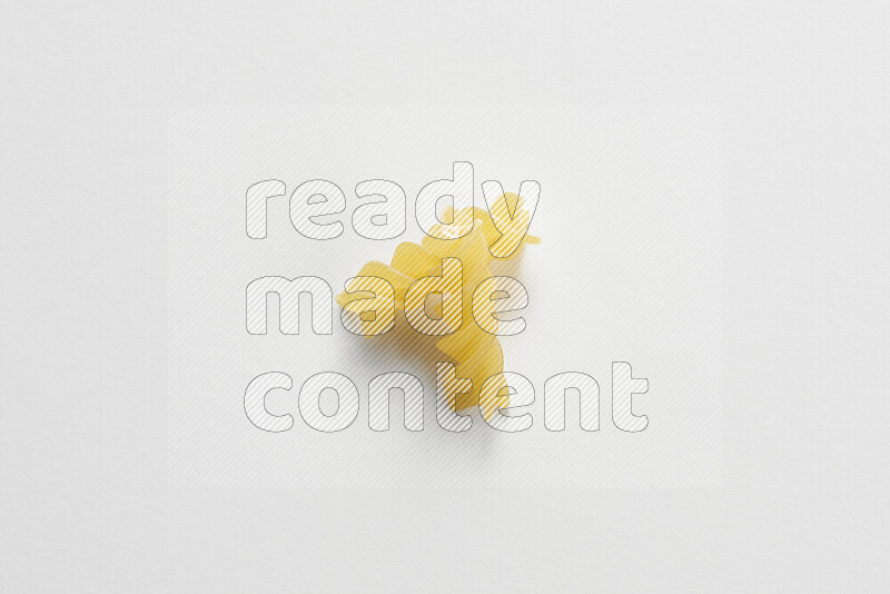 Fusilli pasta on white background