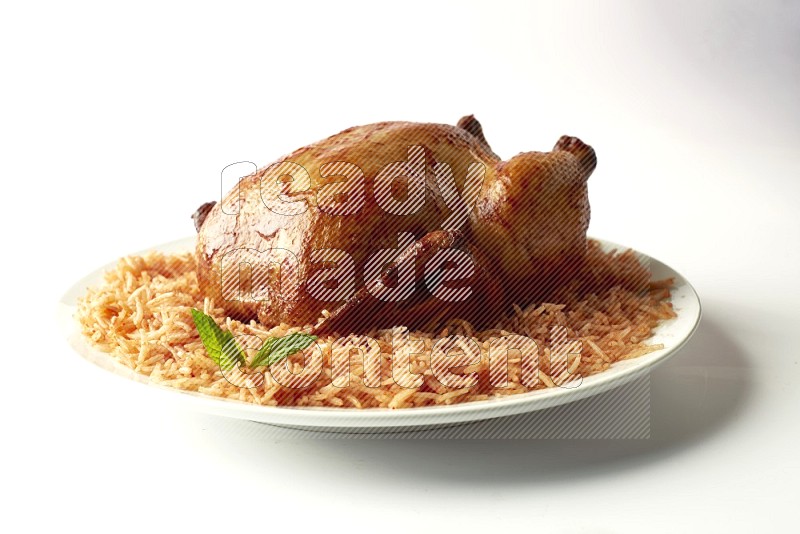 red basmati Rice with  whole roasted chicken on a white rounded plate  direct  on white background