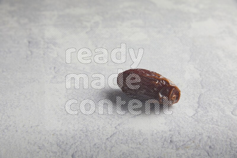 one madjoul date on a light grey background