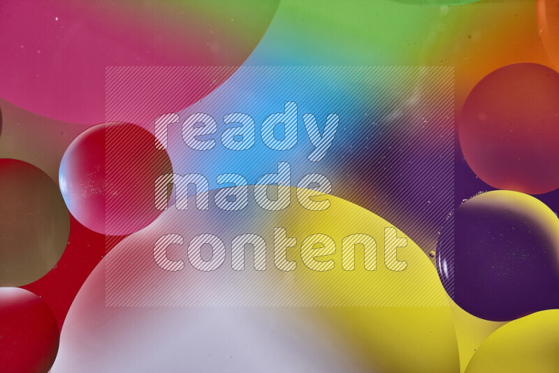 Close-ups of abstract oil bubbles on water surface in multicolors