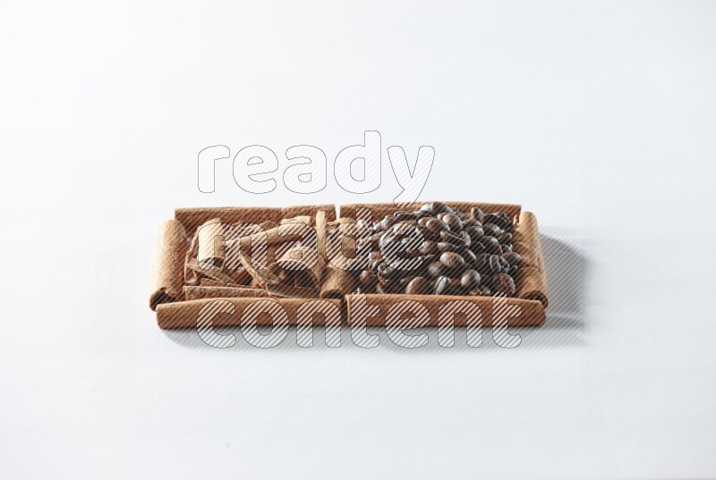 2 squares of cinnamon sticks full of coffee beans and cinnamon on white flooring
