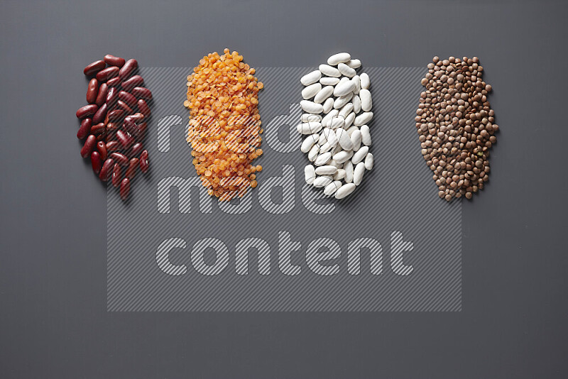 Bunches of legumes on grey background