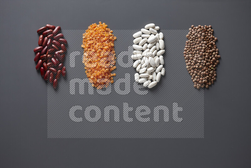 Bunches of legumes on grey background