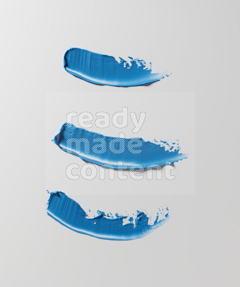 Blue painting knife strokes on white background