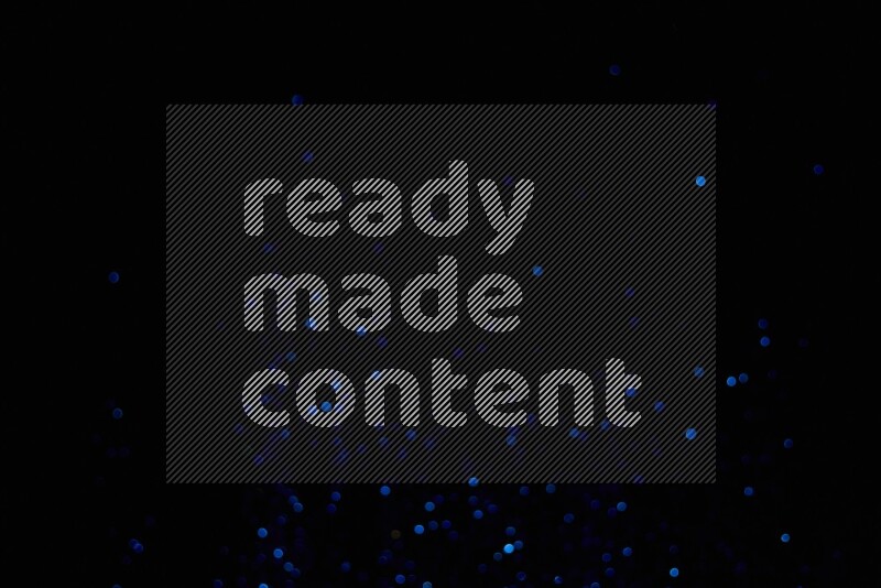 Blue glitter powder isolated on black background