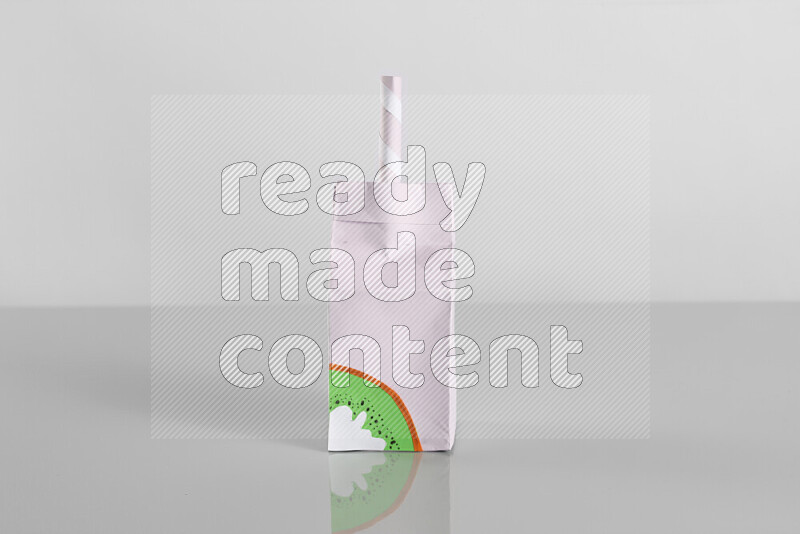 Origami juice box on grey background