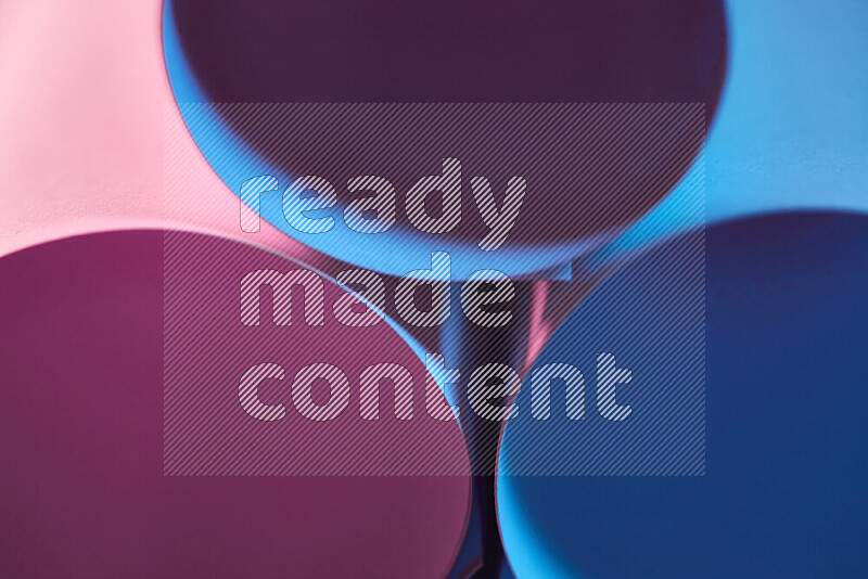 The image shows an abstract paper art with circular shapes in varying shades of blue and pink