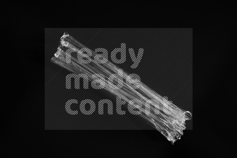 Transparent plastic textures on black background