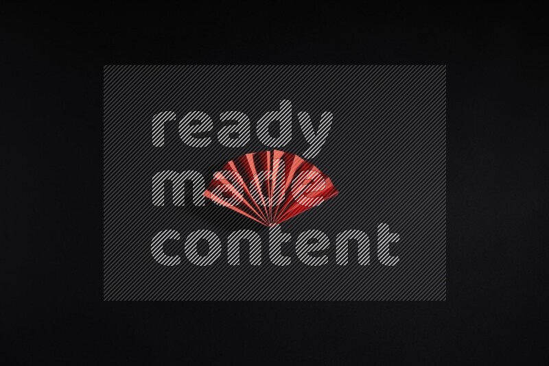 Red paper sheet on black background