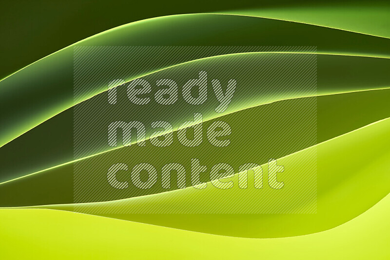 This image showcases an abstract paper art composition with paper curves in green gradients created by colored light