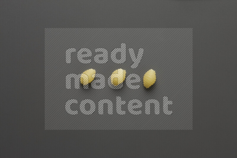 Shells pasta on grey background